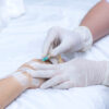 Medical professional administering an IV infusion as part of iron deficiency treatment in Mansfield TX