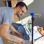 NAD IV Therapy Side Effects: Provider Monitoring a Patient's Infusion