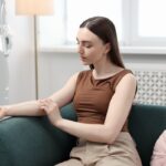How often do you need iron infusions: woman receiving an IV infusion while relaxing at home